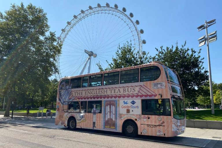 A photo of the Afternoon tea bus passing by the London Eye.