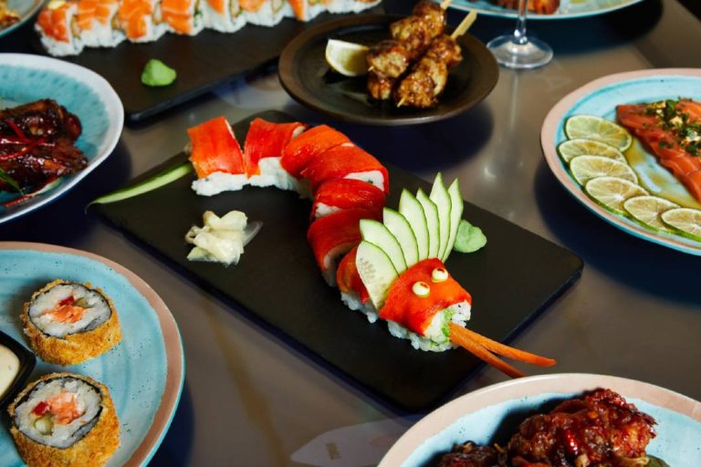 A photo of sushi laid out on a table.